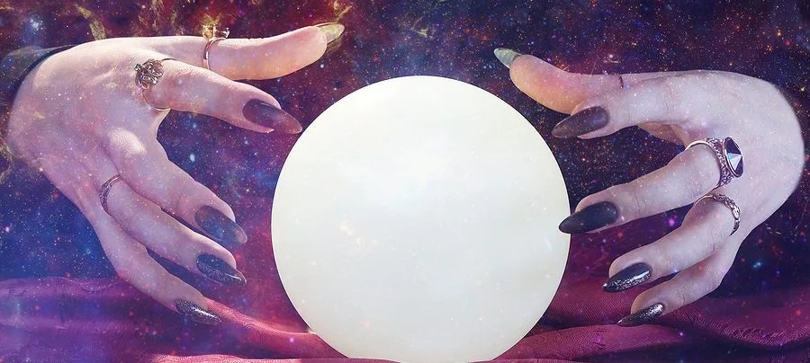 Hands around a crystal ball