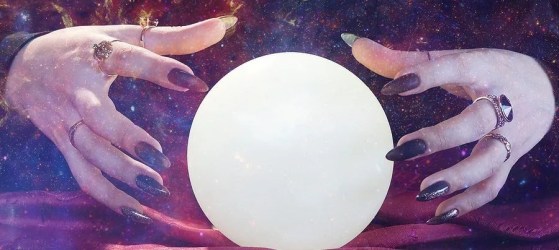 Hands around a crystal ball