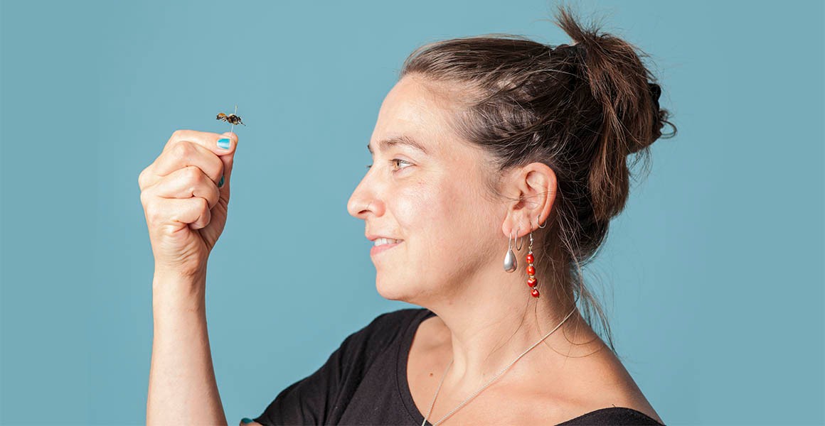 A woman holding a fly