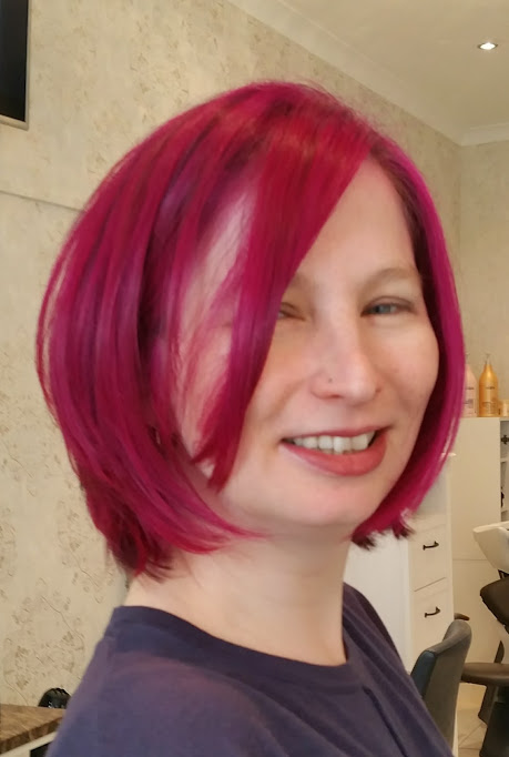 A woman with pink hair