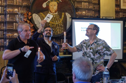 Three men and two candles