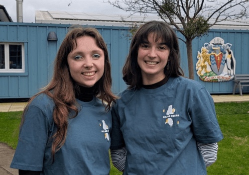 Two women in blue t-shirts