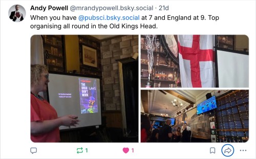 A talk in a pub room with an England flag and another picture of football on TV